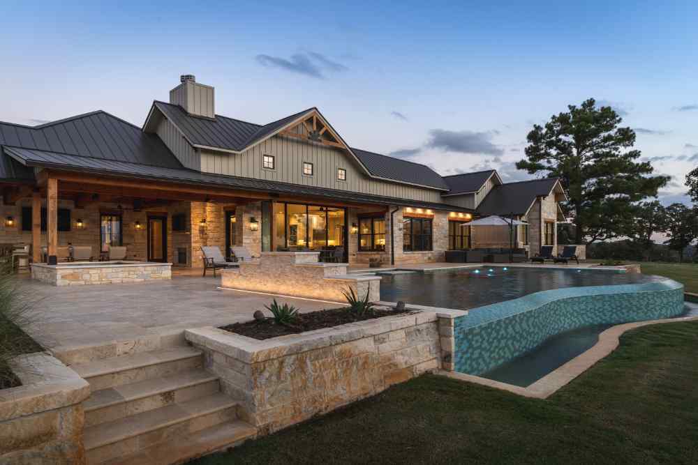 Luxurious custom home with infinity pool and expansive patio by J. Bryant Boyd in Central Texas