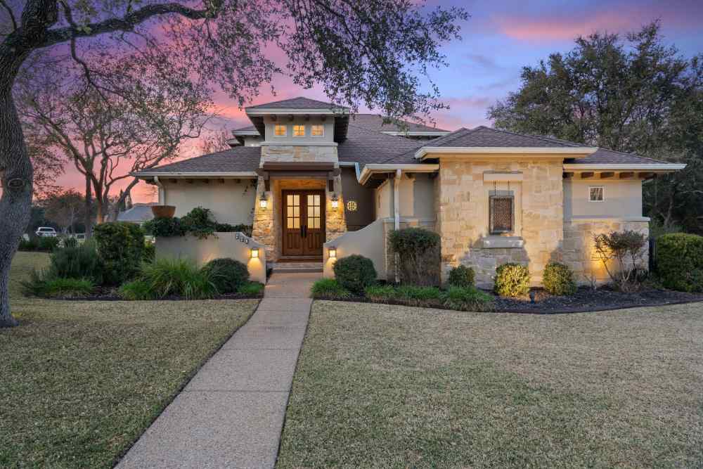 Stunning custom home at sunset by J. Bryant Boyd in Central Texas Hill Country