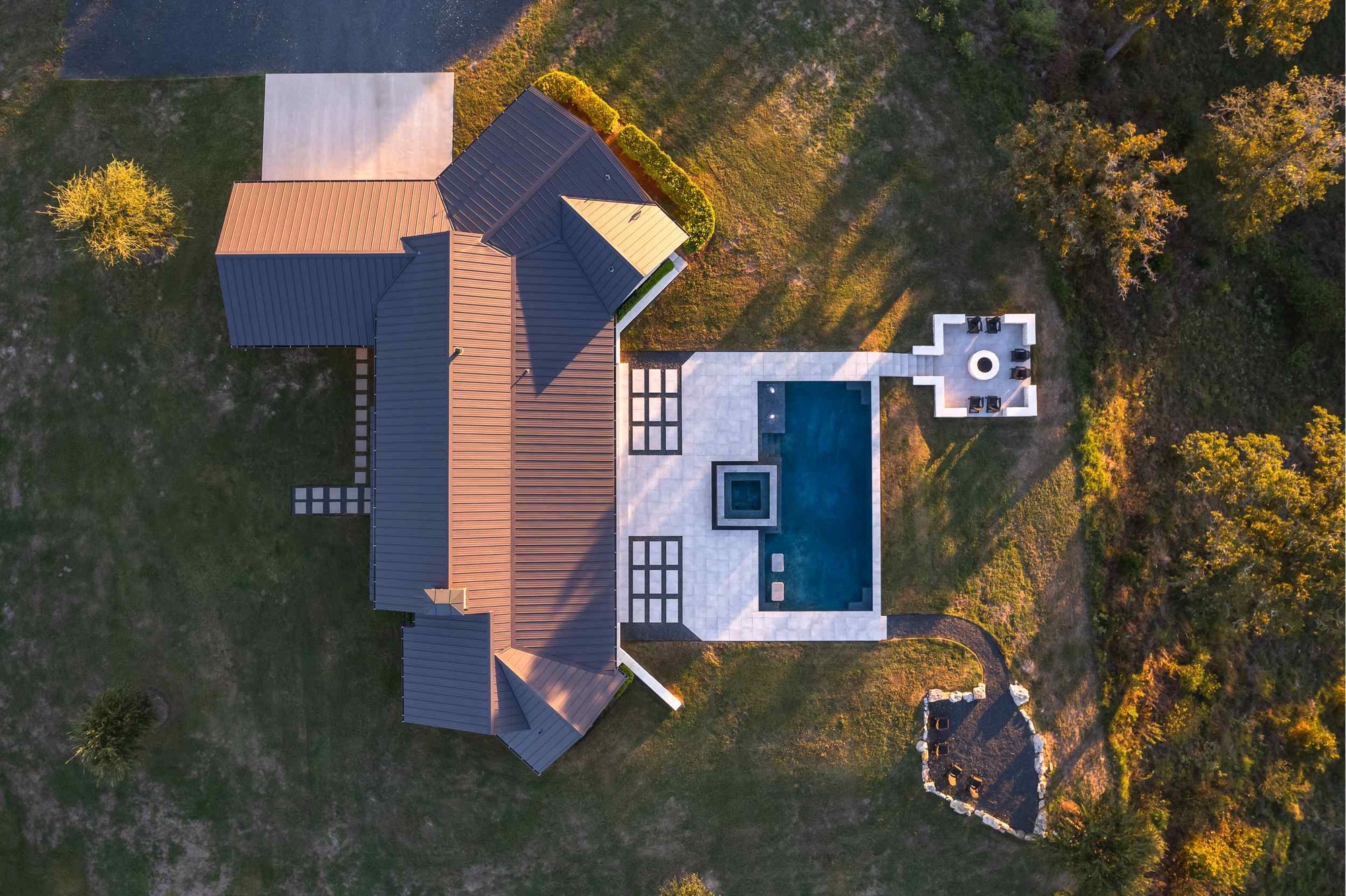 Aerial View of a Modern Farmhouse in the Texas Hill Country by J Bryant Boyd