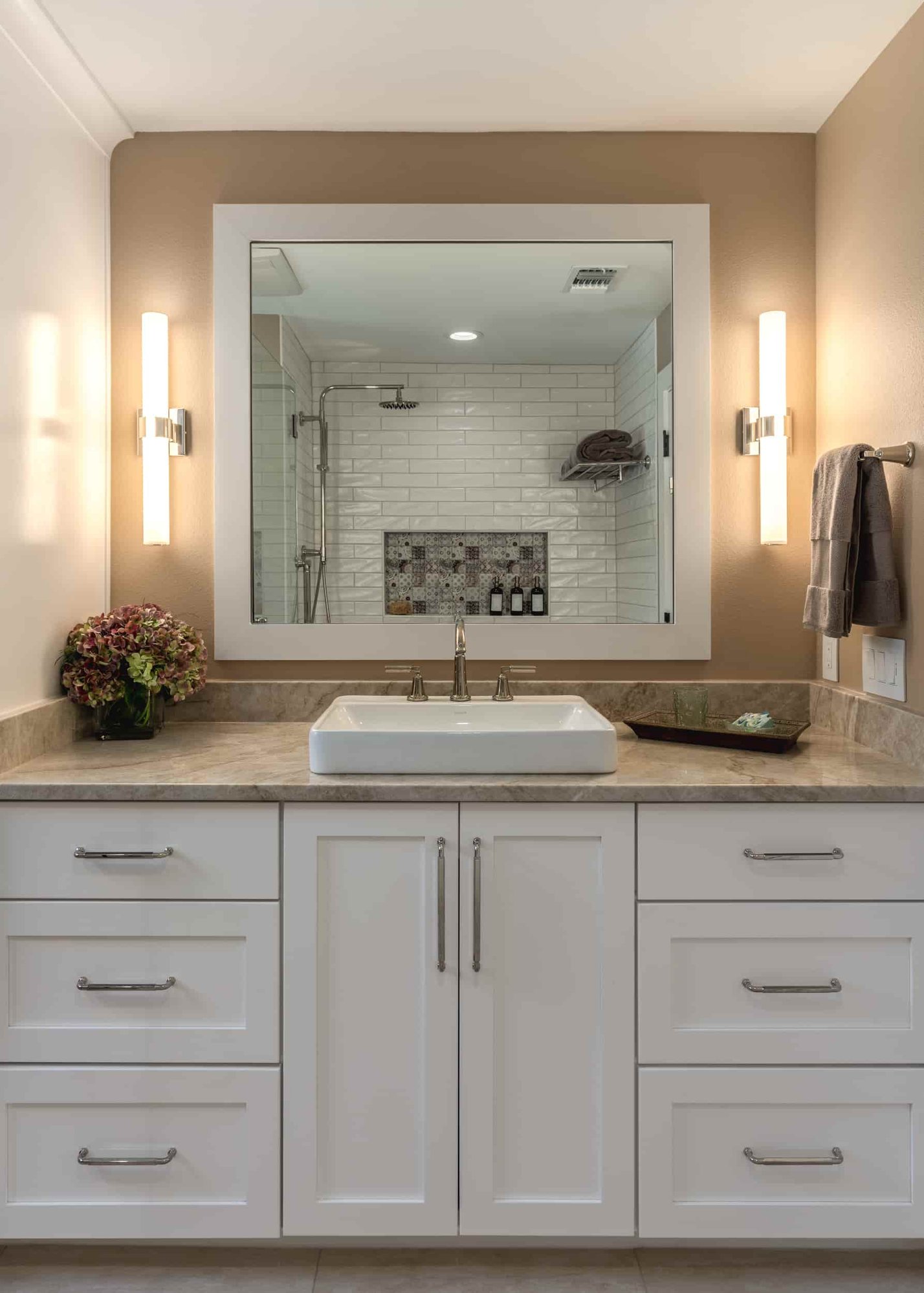 Modern Texas bathroom with a prominent mirror and sink, designed by J Bryant Boyd.  | J Bryant Boyd 
