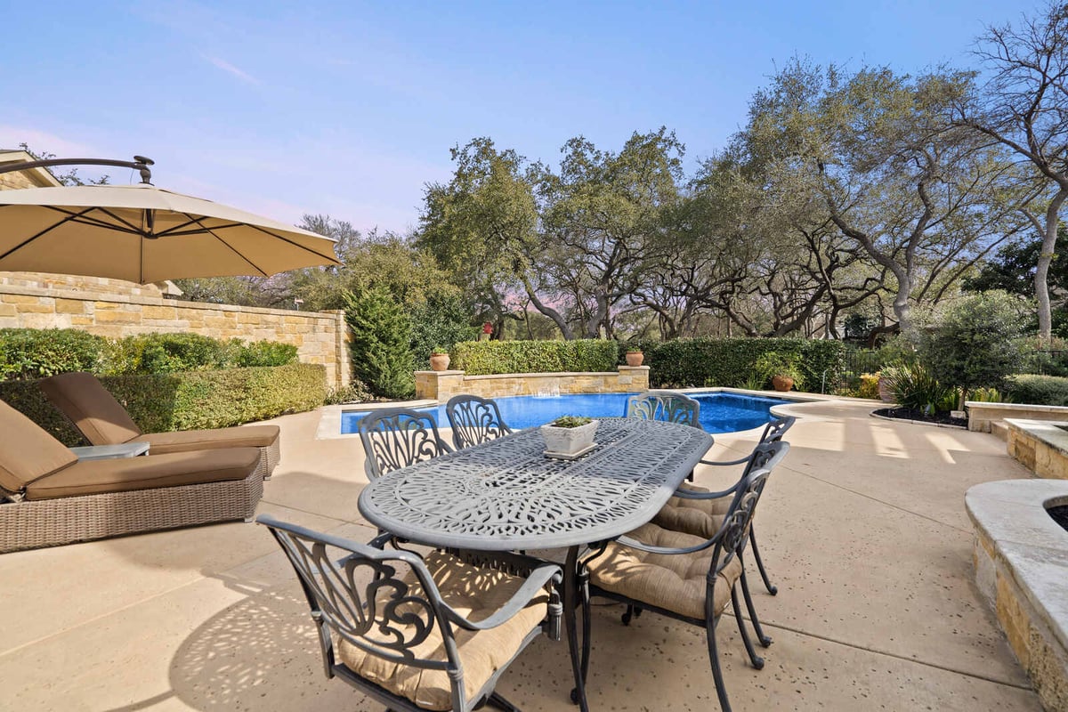 Backyard view of pool and dining area in a custom home by J Bryant Boyd, Georgetown, TX-1