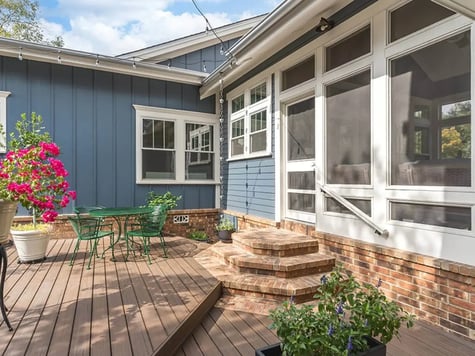 backyard exterior blue siding into sunroom j bryant boyd georgetown tx