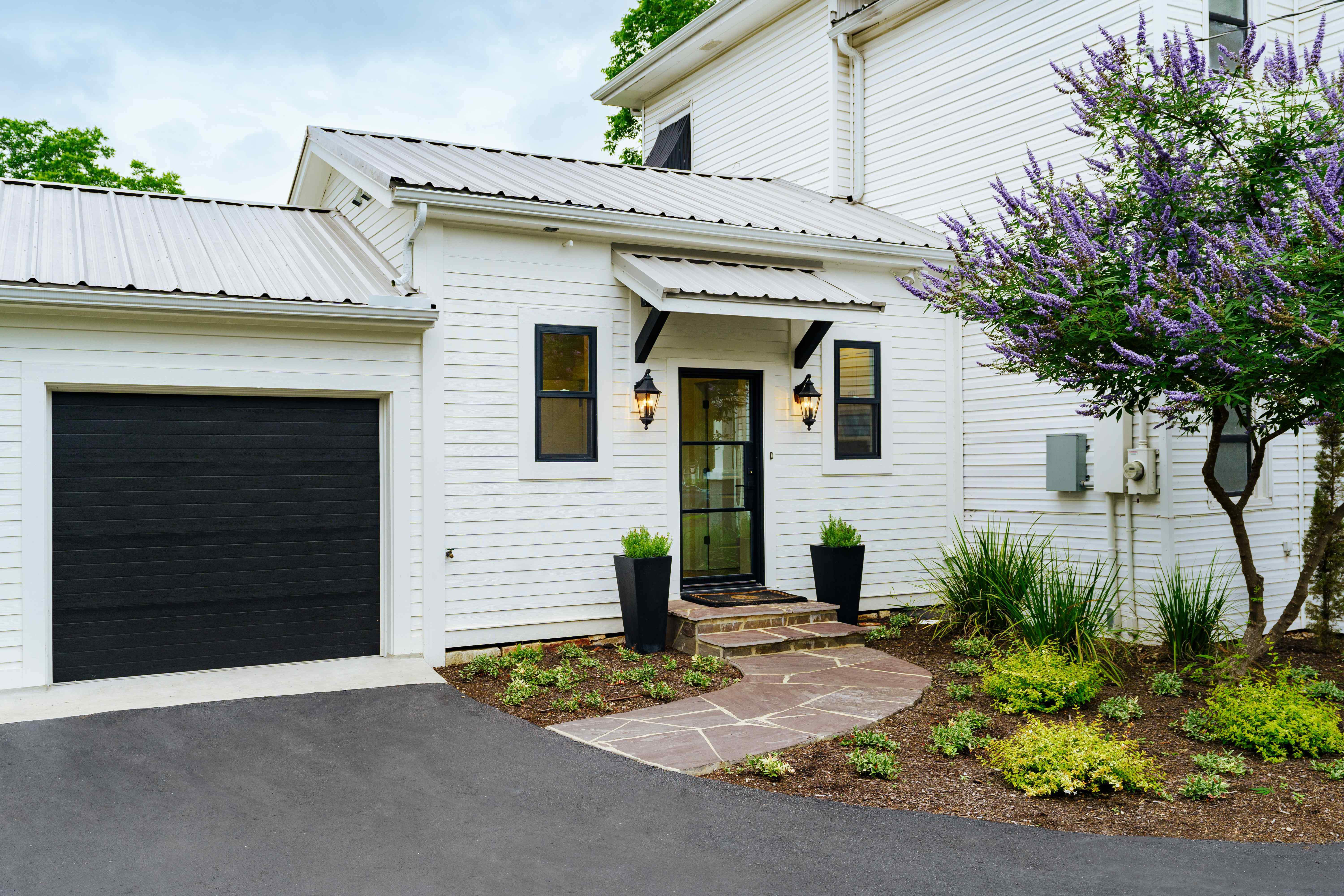 Historic Remodel with Crisp White Siding and Black Trim Details by J Bryant Boyd