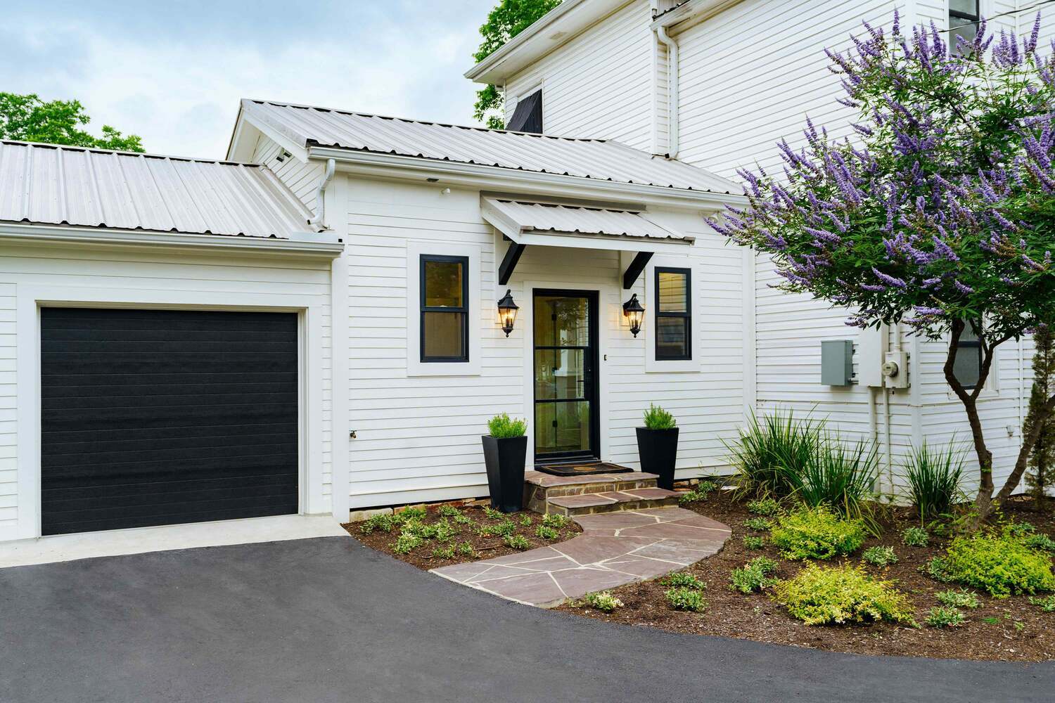 Historic Remodel with Crisp White Siding and Black Trim Details by J Bryant Boyd-1