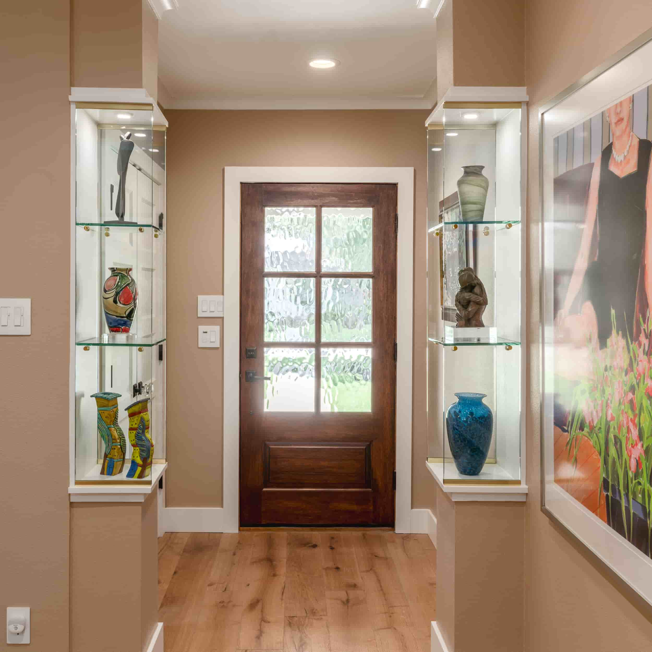 A hallway in Texas featuring a door and a framed picture on the wall, captured by J Bryant Boyd.